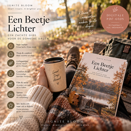 A lifestyle promotional graphic for Ignite Bloom's 'Een Beetje Lichter' digital PDF guide. A person in a cozy knit sweater holds a coffee mug and the printed guide, set against a warm, sunlit autumn outdoor scene with a picnic blanket and backpack.